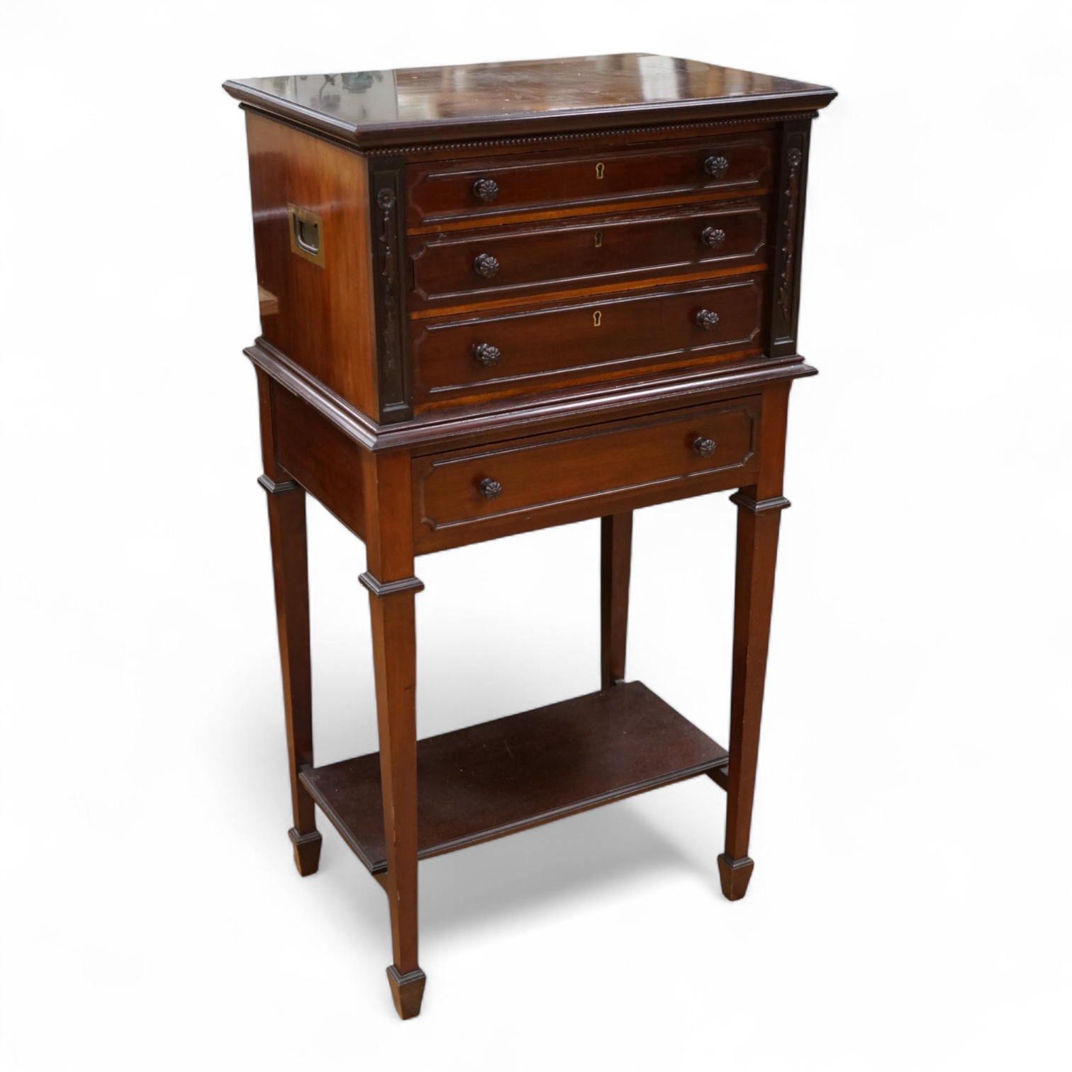 A canteen of cutlery by Viners, contained within a four drawer floor standing cabinet. 110cm tall